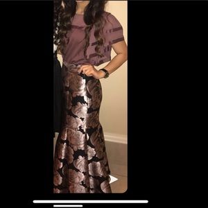 No sign of wear. Long Floral skirt.